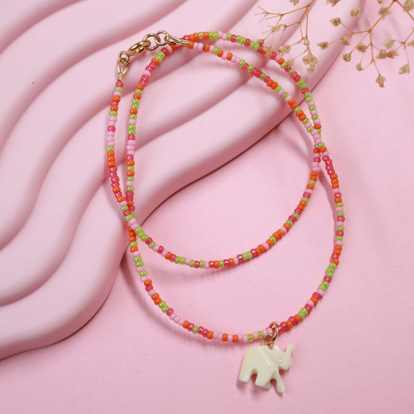 Seed bead choker with elephant pendant